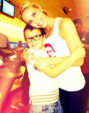 Brenna Ballestero bowling with her son